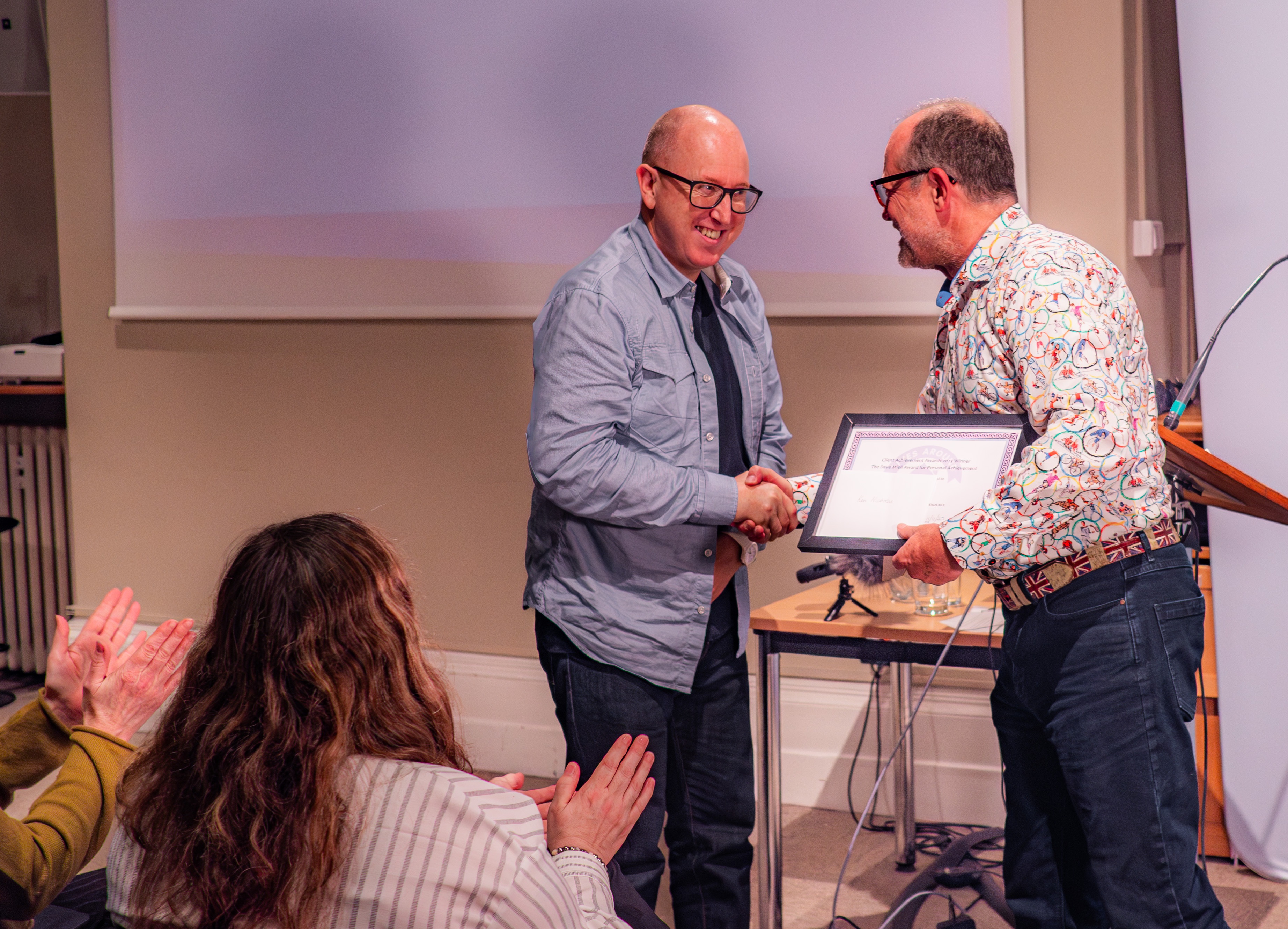 Ken Nicholas (left) accepts his award from Martin Buckland