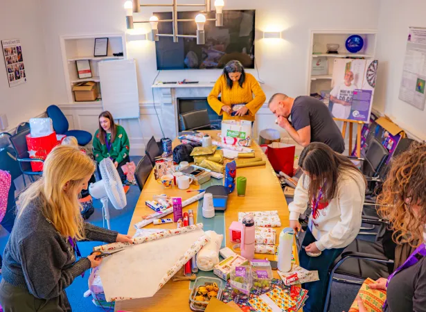 DHI colleagues wrap presents donated by Dunelm customers